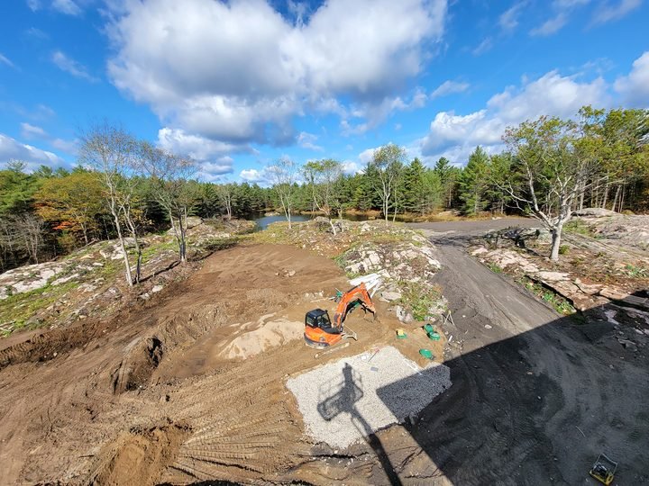 Excavation and site preparation on a wooded Muskoka property