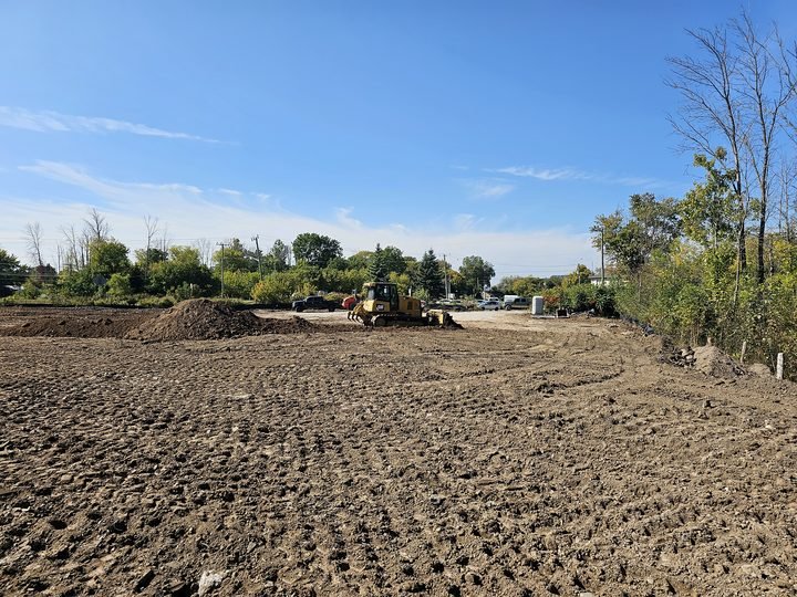 Final grading across an open construction site